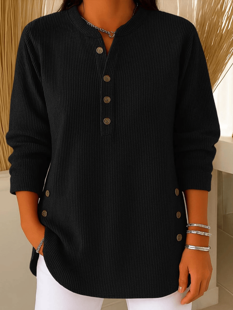 Tunique noire à boutons, maille côtelée, manches longues, encolure henley.