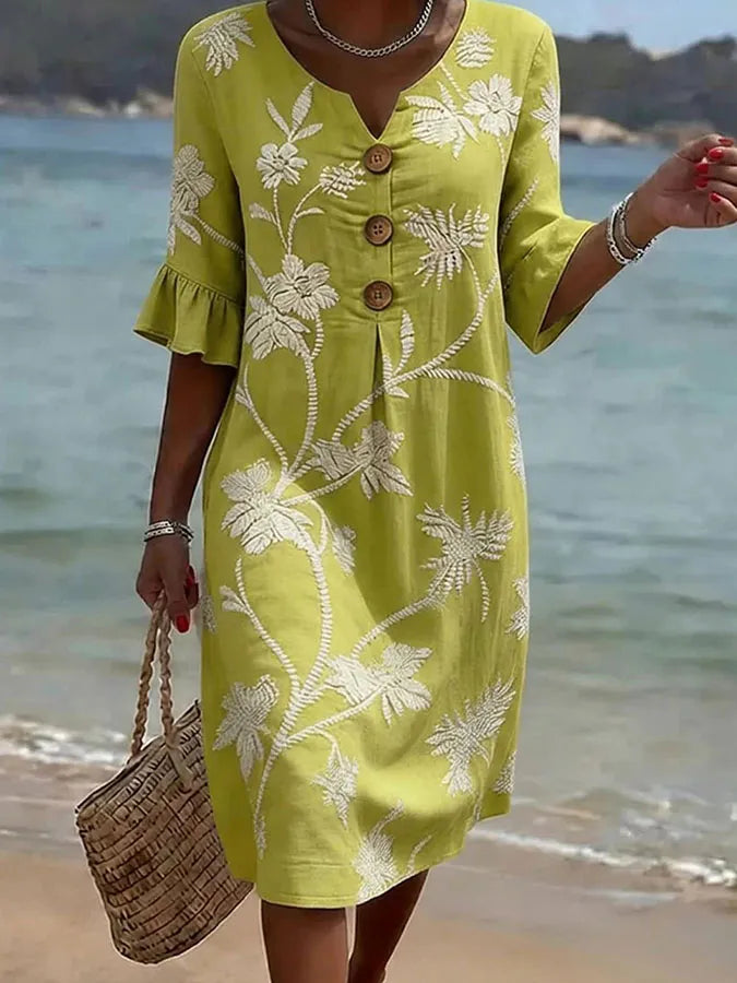 Robe informelle jaune à imprimé floral blanc, encolure V boutonnée et manches volant