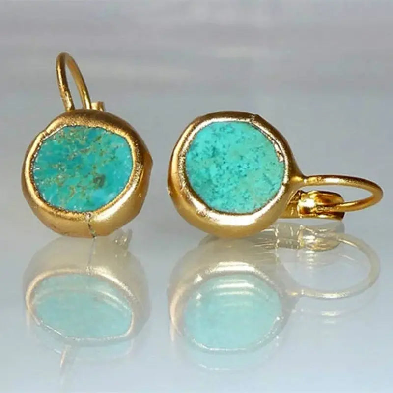 Boucles d’oreilles dorées rondes avec pierre turquoise