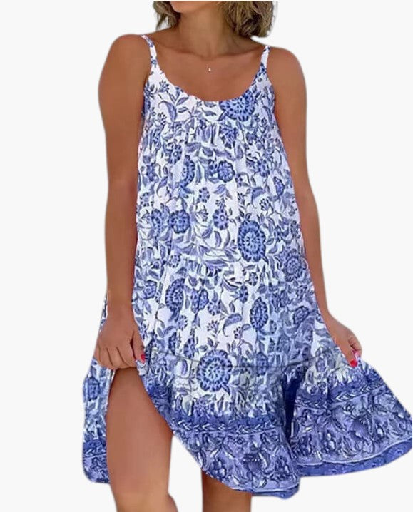 Robe légère bleue à bretelles, imprimé floral, volants et ouverture sur la jambe