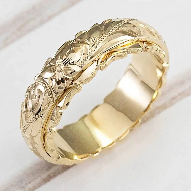 Bague en or jaune gravée de motifs floraux, anneau à bord sculpté