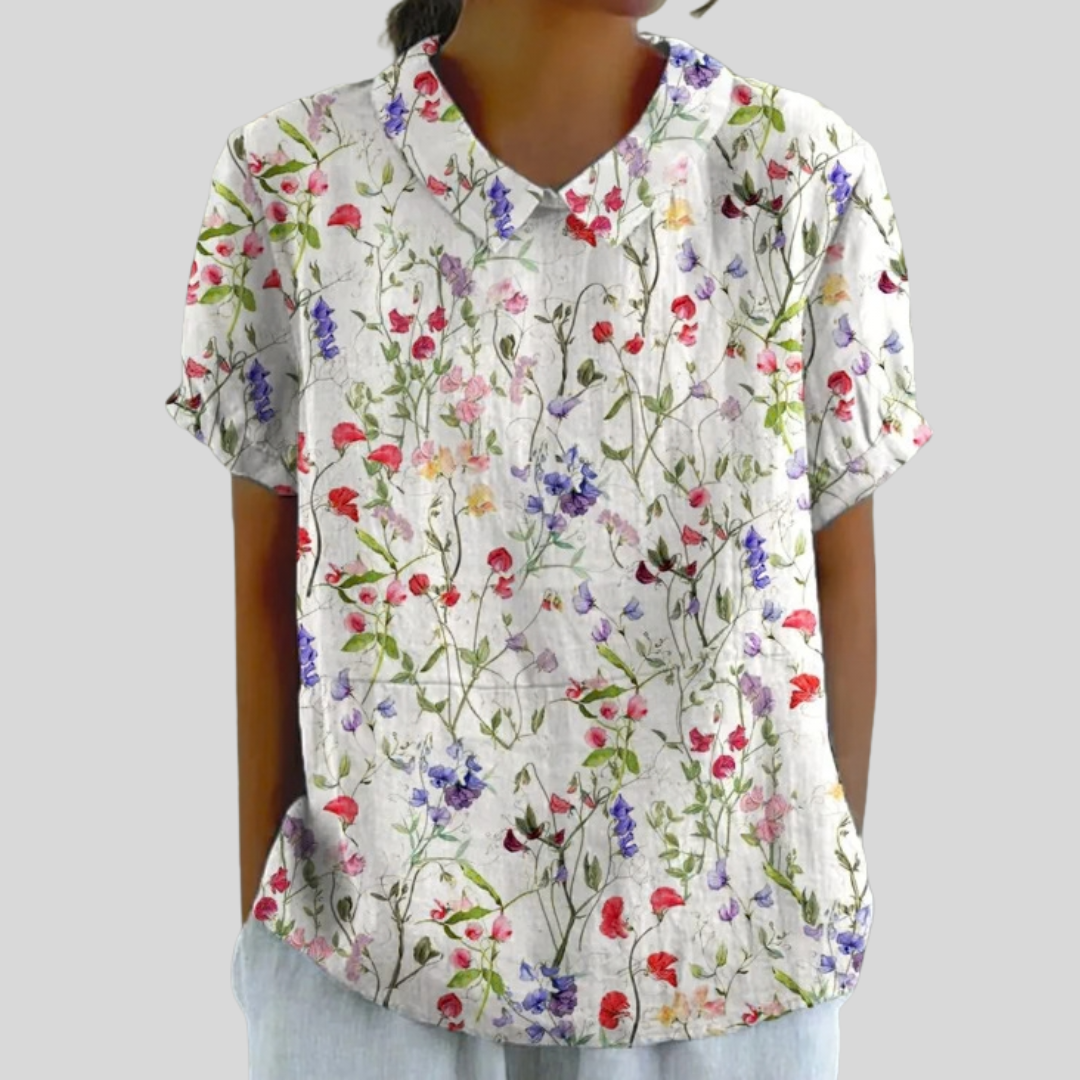Blouse légère blanche à fleurs multicolores, encolure en V et manches courtes