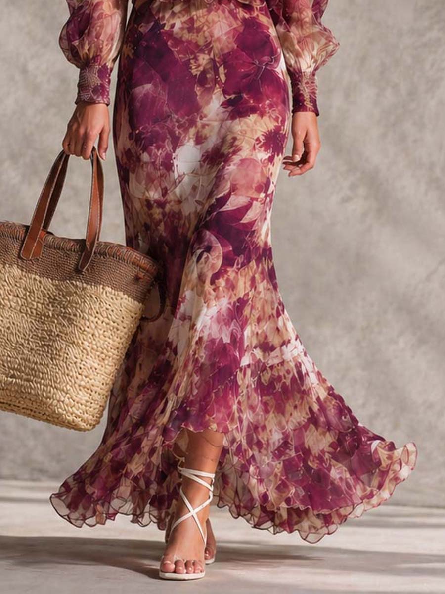 Robe longue motif floral, manches bouffantes, ourlet volanté, portee près du sol