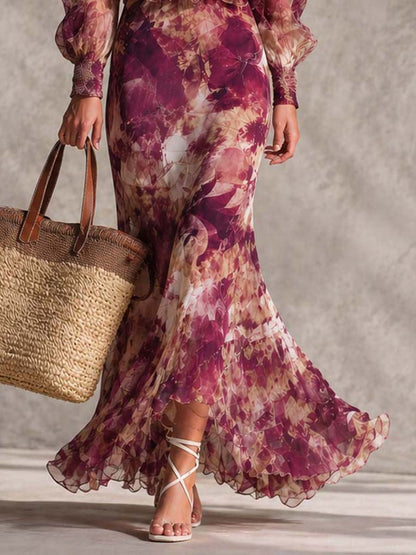 Robe longue motif floral, manches bouffantes, ourlet volanté, portee près du sol