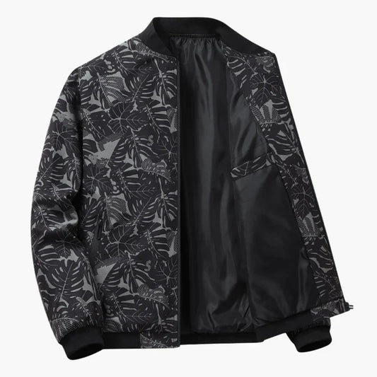 Blouson bomber noir à imprimé feuilles, fermeture zippée, col et poignets côtelés.