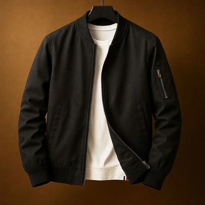 Blouson bomber zippé noir, col et poignets côtelés, poche zippée sur la manche