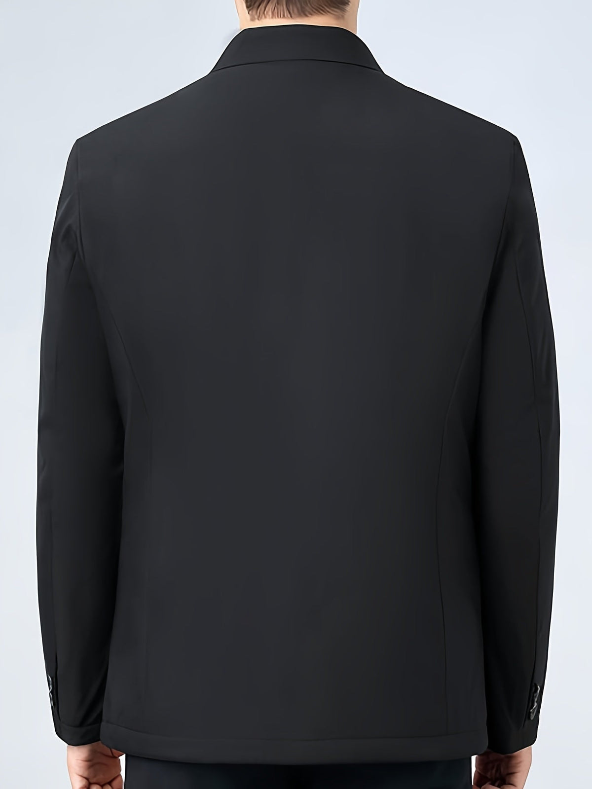 Veste à col à revers noire vue de dos, fermeture sur le devant et coutures verticales