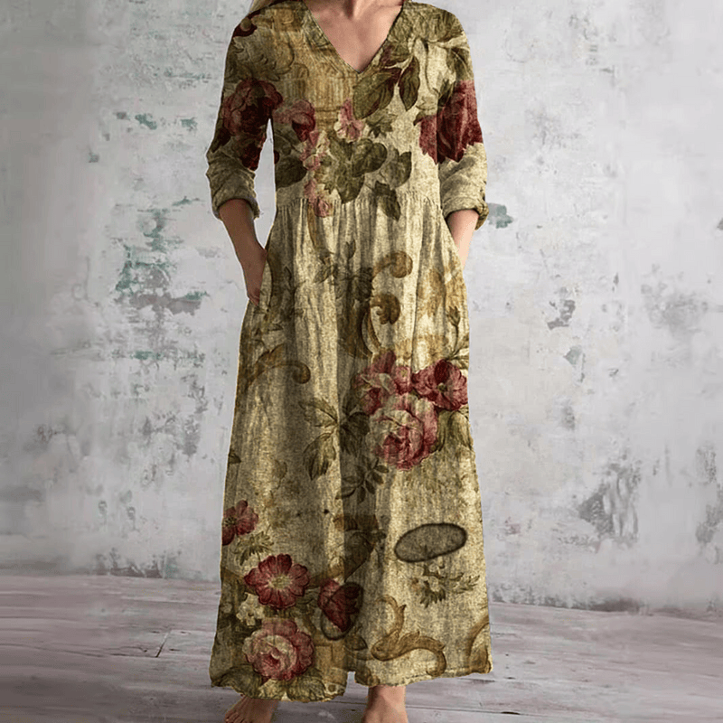 Robe d’été longue ample à col V, manches 3/4, imprimé floral sur fond beige.