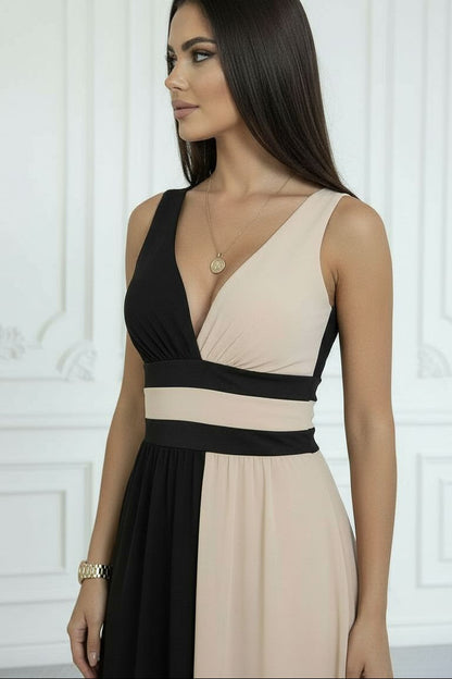 Robe longue sans manches bicolore noir et nude, décolleté V croisé et taille ceinturée.