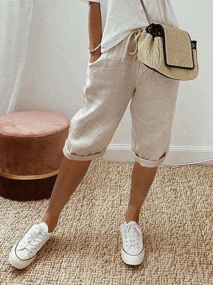 Pantalon 3/4 en lin coton beige clair, taille à cordon, poches, jambes retroussées