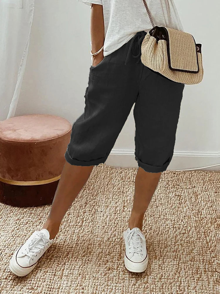 Pantalon 3/4 en lin coton noir, taille à cordon, poches, jambes retroussées