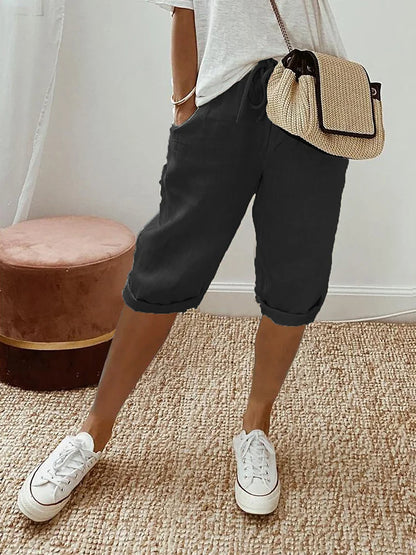 Pantalon 3/4 en lin coton noir, taille à cordon, poches, jambes retroussées