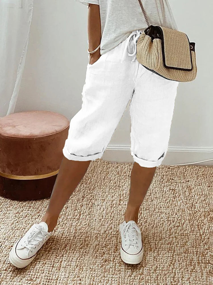 Pantalon 3/4 en lin coton blanc, taille à cordon, poches, jambes retroussées