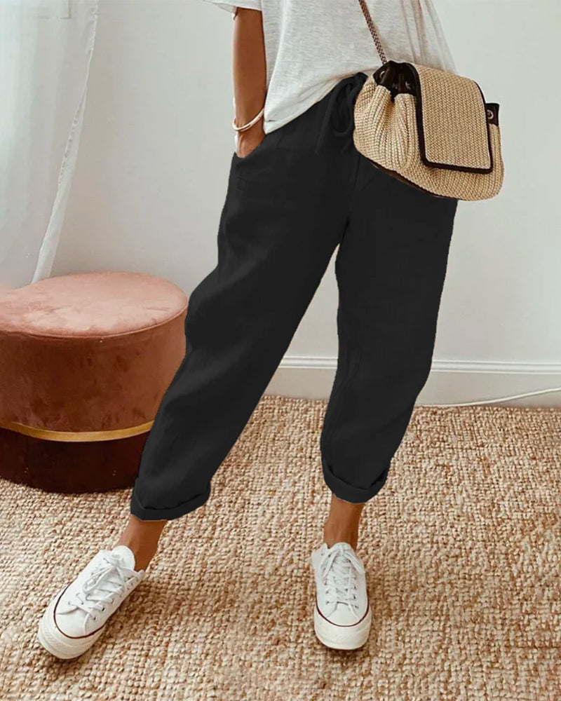 Pantalon fluide noir, taille élastique, jambes amples jusqu’aux chevilles