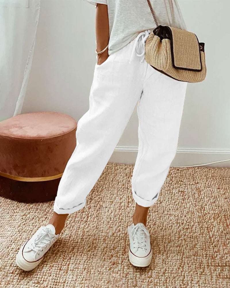 Pantalon fluide blanc, taille élastique, jambes amples jusqu’aux chevilles