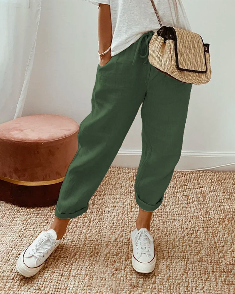 Pantalon fluide vert foncé, taille élastique, jambes amples jusqu’aux chevilles