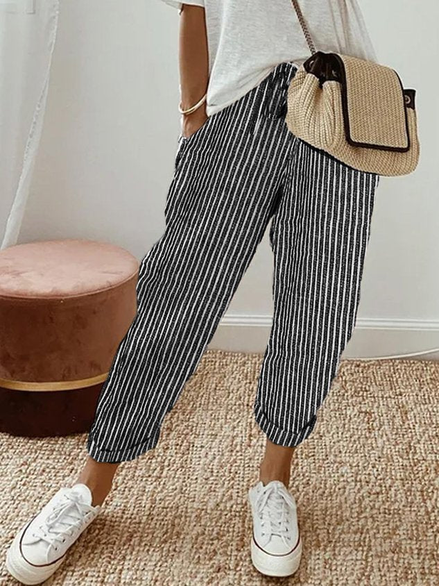 Pantalon fluide rayé bleu nuit et blanc, taille élastique, jambes amples aux chevilles