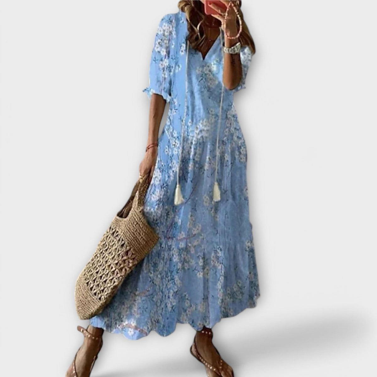 Robe longue ample bleu clair à motifs floraux, manches courtes