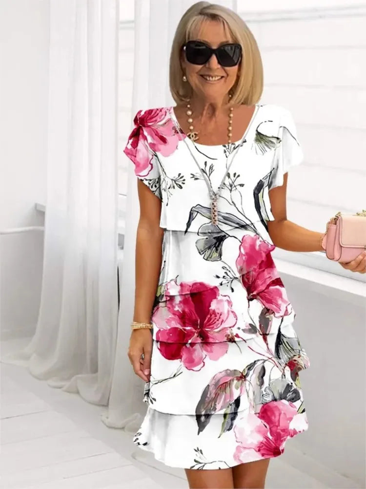 Robe blanche fluide à volants, imprimé fleurs roses, manches courtes et encolure carrée