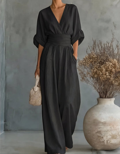 Combinaison noire décolleté V, ceinture, jambes larges, manches larges