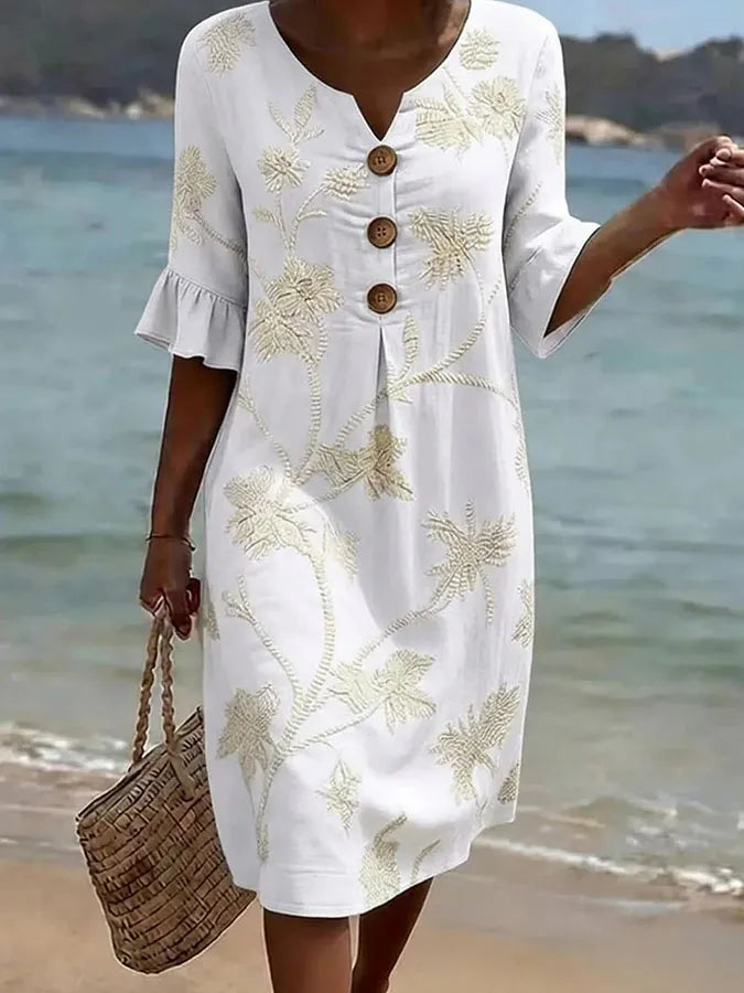 Robe décontractée blanche à imprimé floral, encolure boutonnée et manches courtes évasées