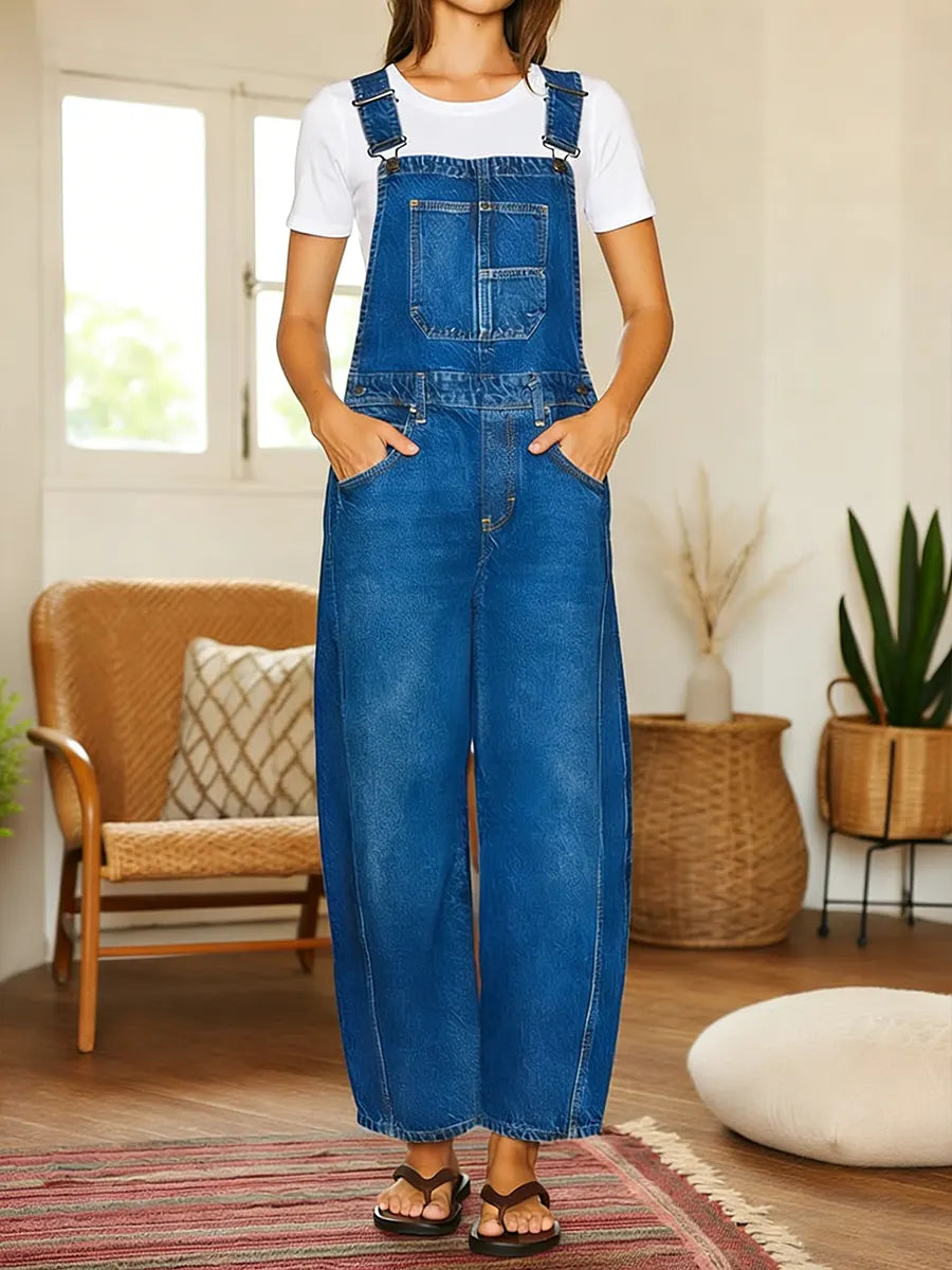 Salopette en jean bleue avec bretelles, poches poitrine et poches avant, jambes longues