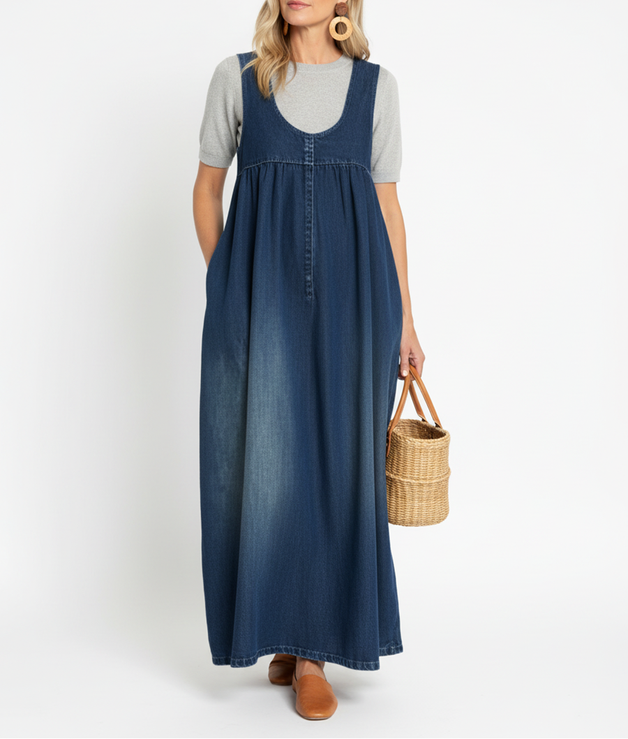Robe longue en denim bleu, sans manches, devant à coutures verticales et évasement