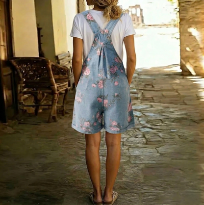 Salopette en denim bleu vintage à fleurs roses, bretelles croisées au dos
