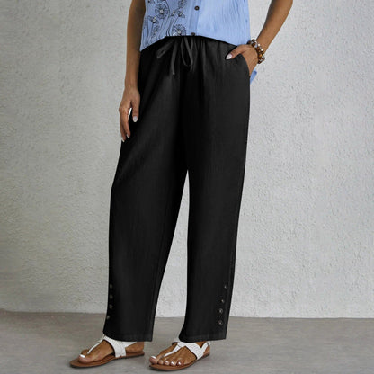 Pantalon ample noir avec cordon à la taille, boutons sur le côté et ourlet ajouré