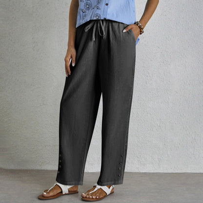 Pantalon ample gris foncé avec cordon à la taille, boutons latéraux et ourlet ajouré