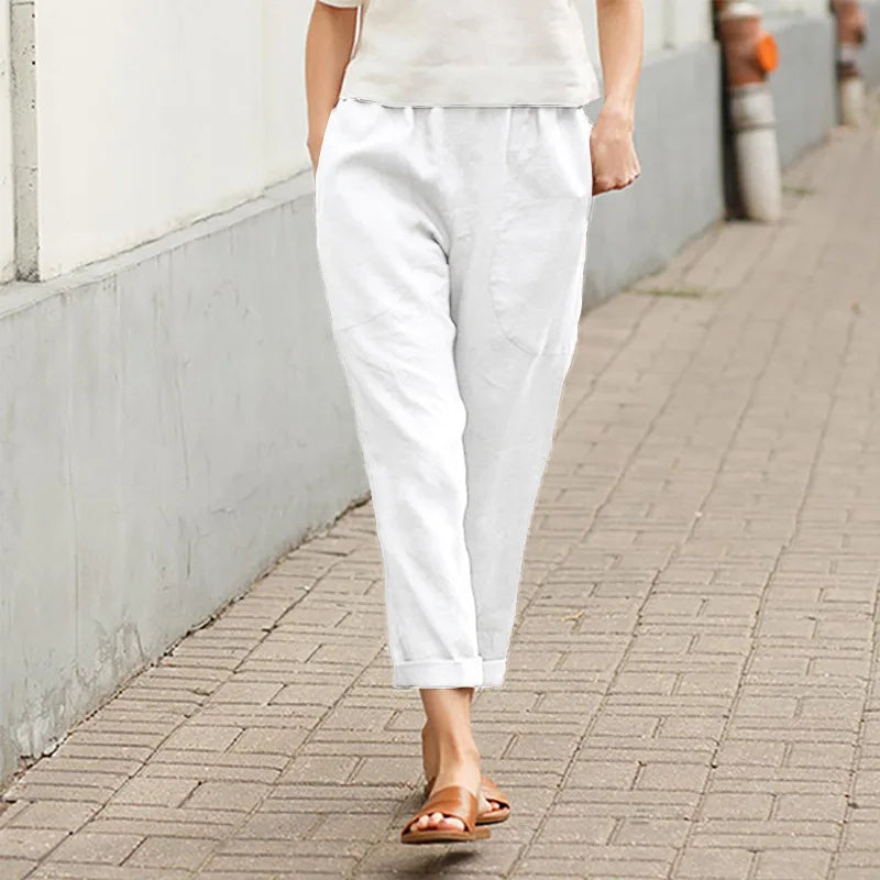 Pantalon ample blanc, poches sur les côtés, taille élastique, cheville resserrée