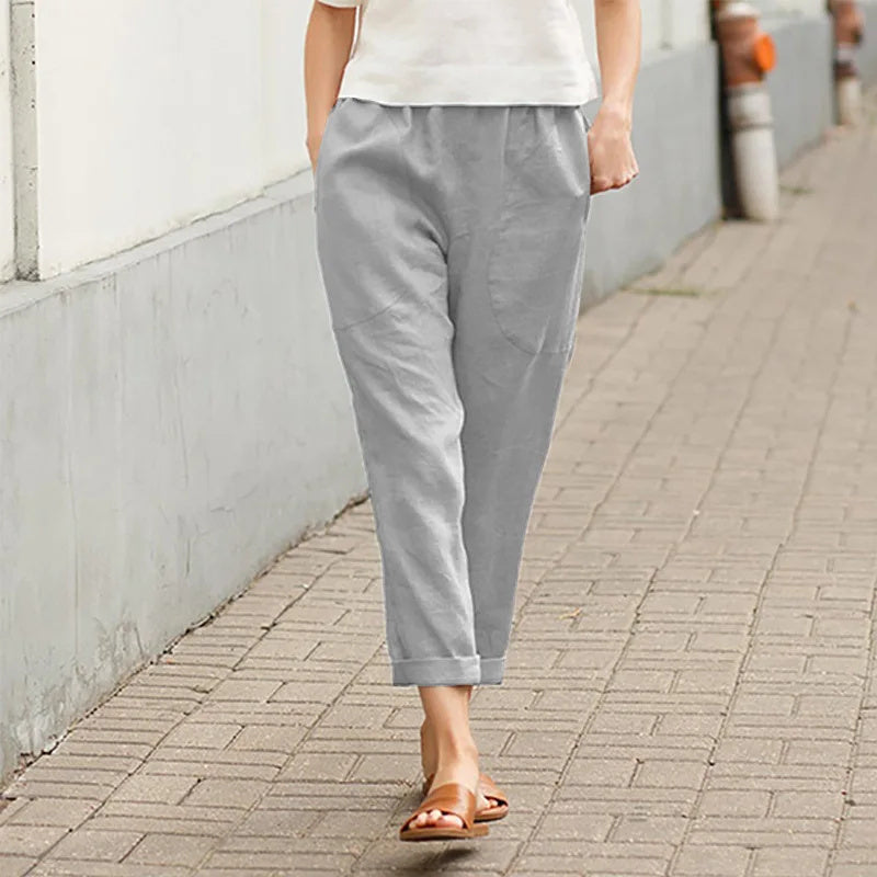 Pantalon ample gris avec poches, taille élastique, cheville resserrée