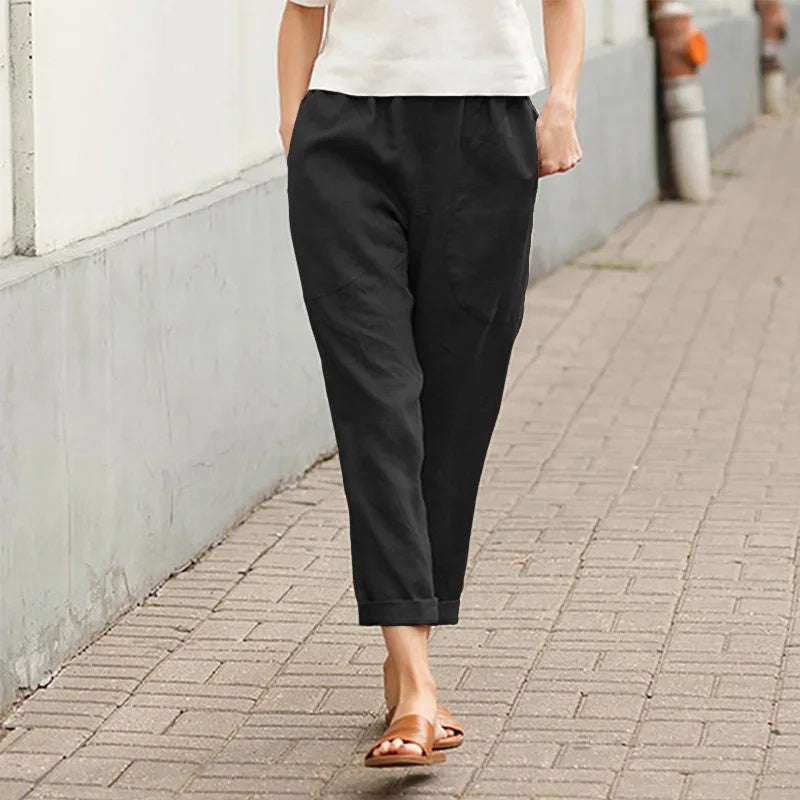 Pantalon ample noir avec poches, taille élastique, bas légèrement resserré