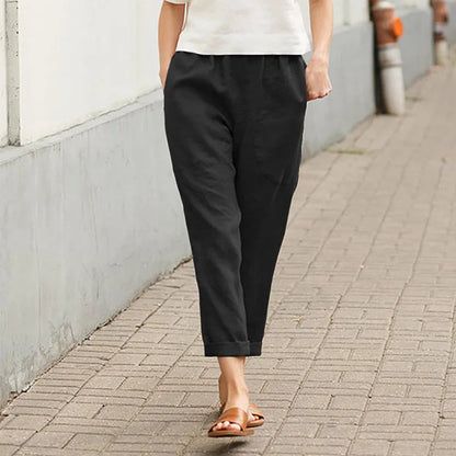 Pantalon ample noir avec poches, taille élastique, bas légèrement resserré