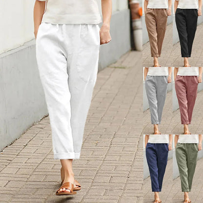 Pantalon ample blanc avec poches, taille élastique, bas légèrement resserré