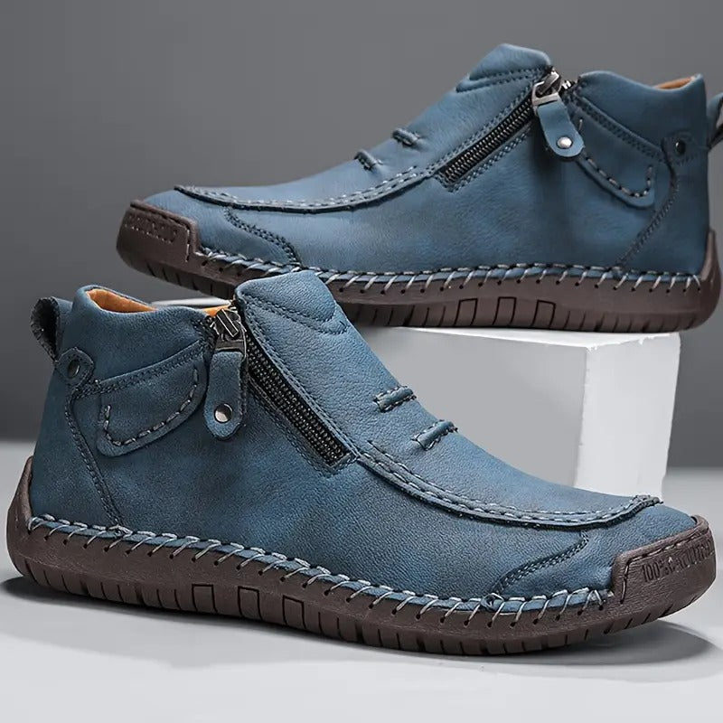 Chaussures montantes bleues en cuir, fermeture éclair latérale et semelle crantée