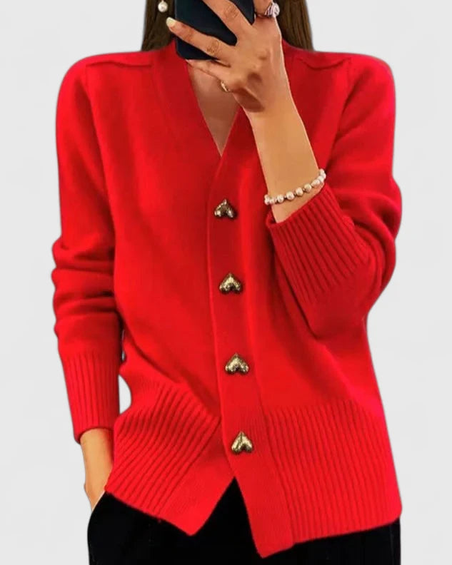 Cardigan rouge à col V, boutons dorés, manches longues et bas côtelé.