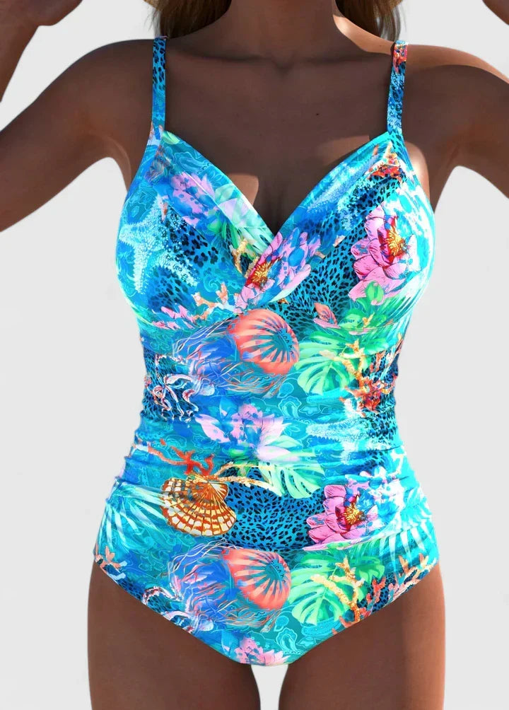 Maillot de bain une pièce cyan à imprimé tropical, décolleté en V et découpe