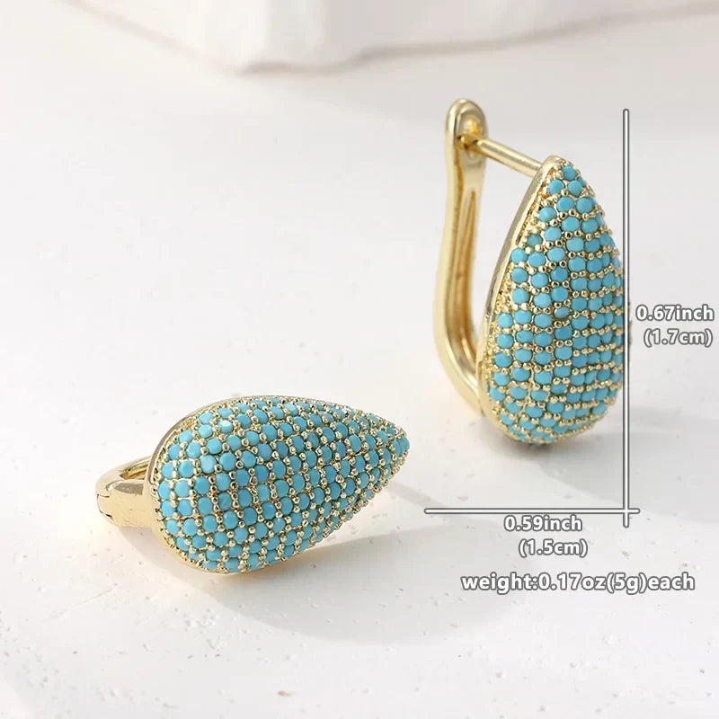 Boucle d’oreille larme turquoise pavée, monture dorée avec tige
