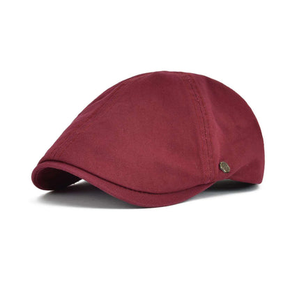 Casquette de golf Bloom™ en coton rouge, visière courbée, écusson rond.