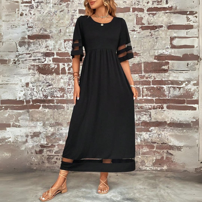 Robe midi noire évasée, manches mi-longues, ourlet sombre à empiècements transparents