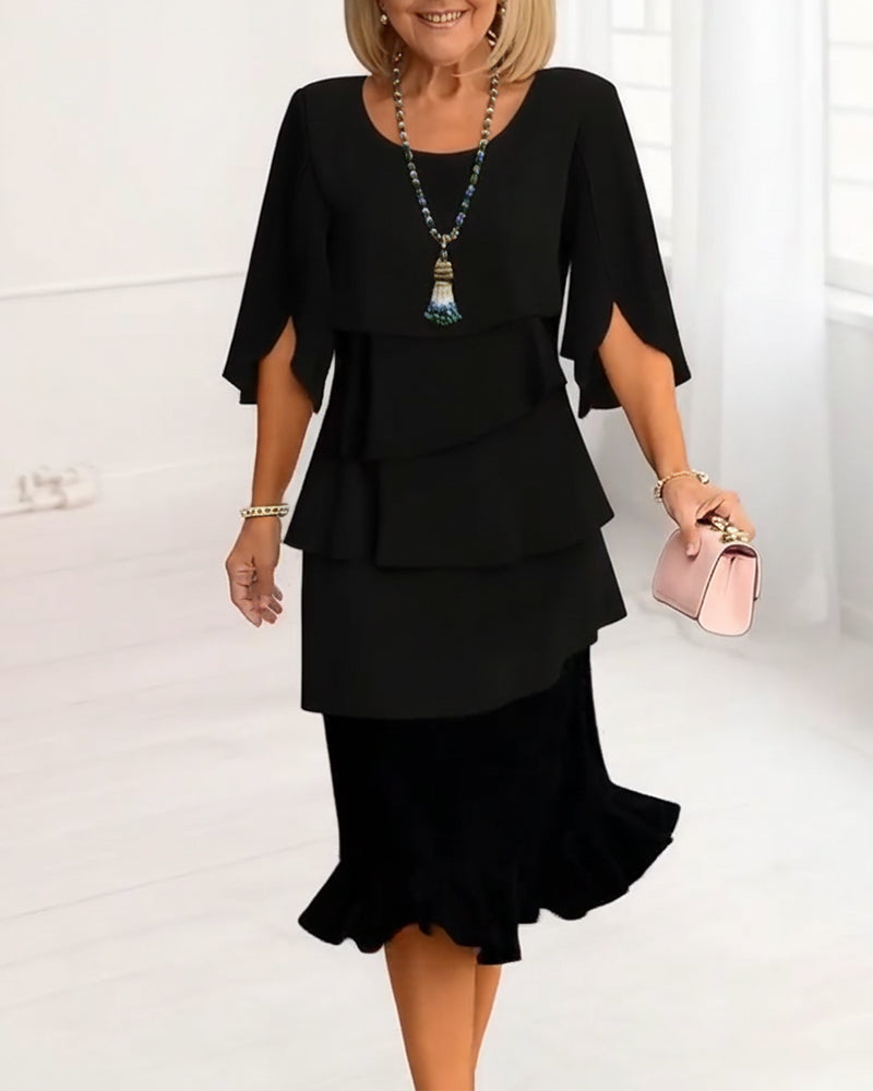 Robe fluide noire à volants étagés, manches courtes, coupe mi-longue