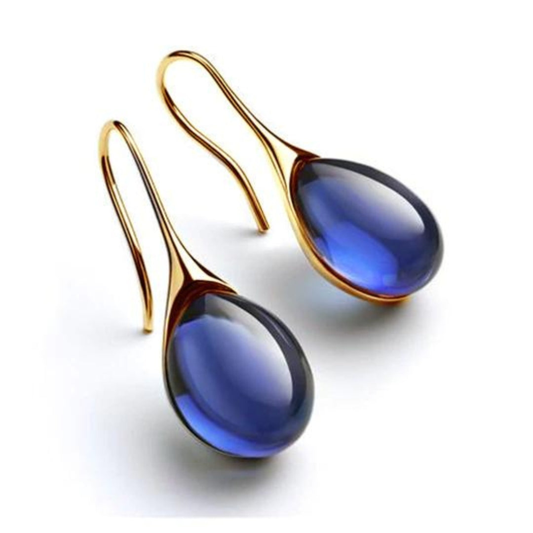 Boucles d’oreilles pendantes dorées à goutte en cristal bleu