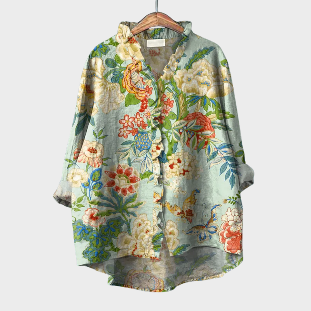 Blouse Perrine à manches amples, col chemise, imprimé floral vert et crème.