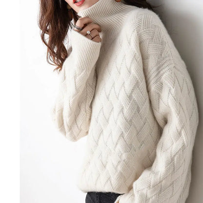 Pull col roulé beige clair à motif chevrons, manches bouffantes, coupe ample