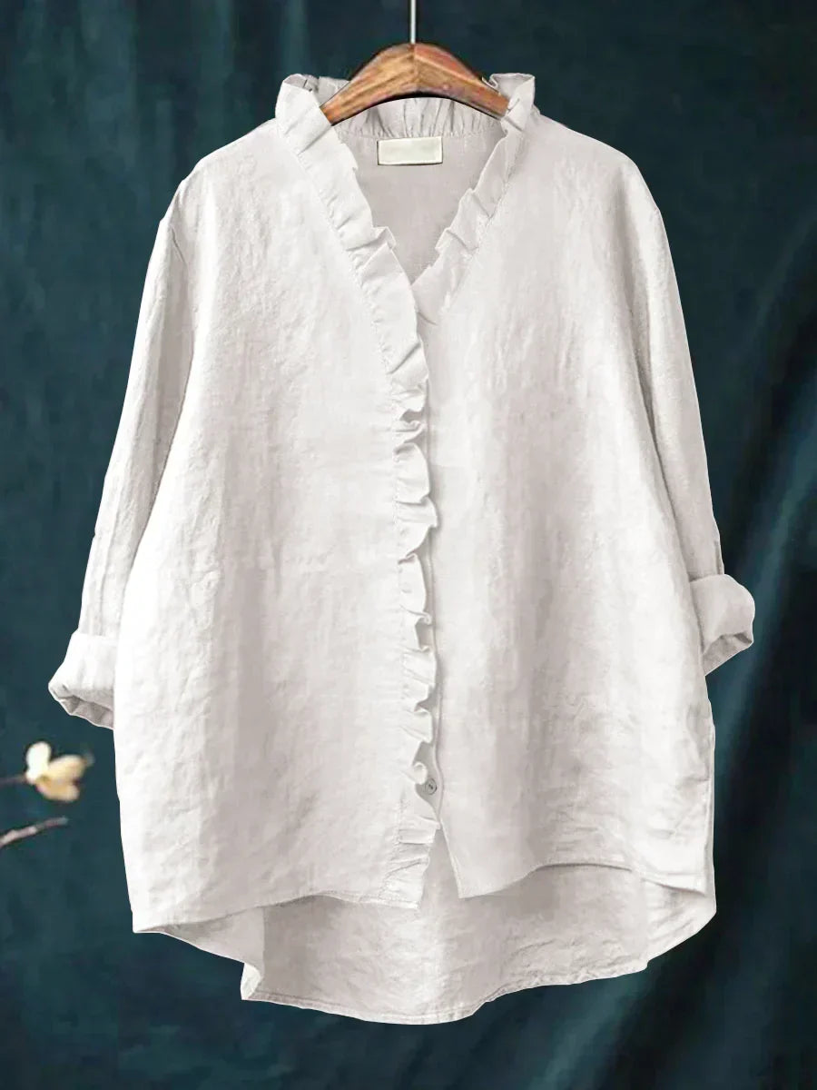 Blouse légère blanche à col V, volants sur l’avant et boutons, manches amples
