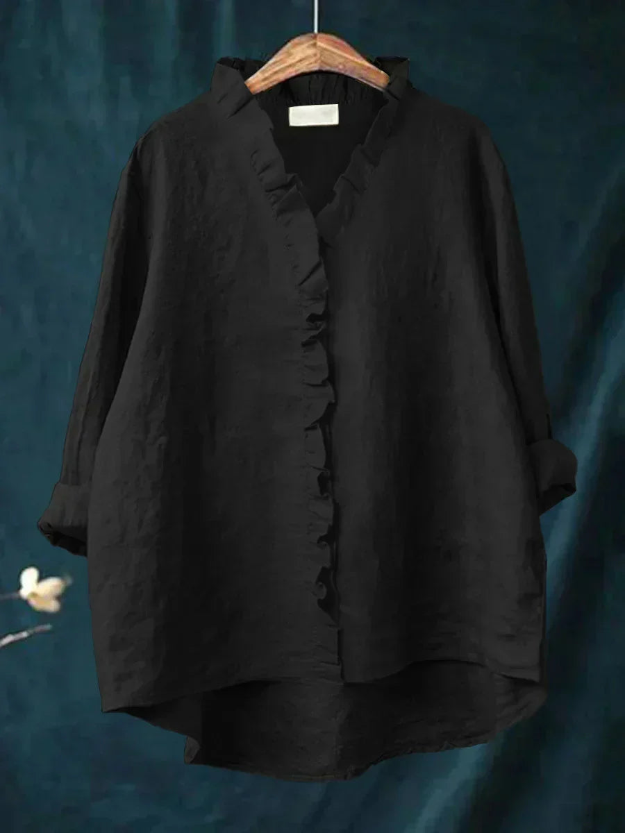 Blouse légère noire à col V, volants sur l’avant et boutons, manches amples