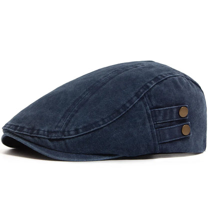 Casquette vintage homme bleu indigo, visière courbe, deux boutons décoratifs sur le côté.