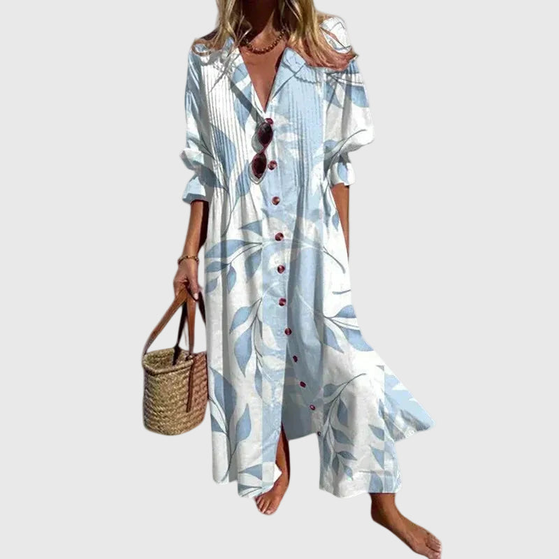 Robe maxi blanche à motifs bleu, encolure en V boutonnée, manches courtes, longue