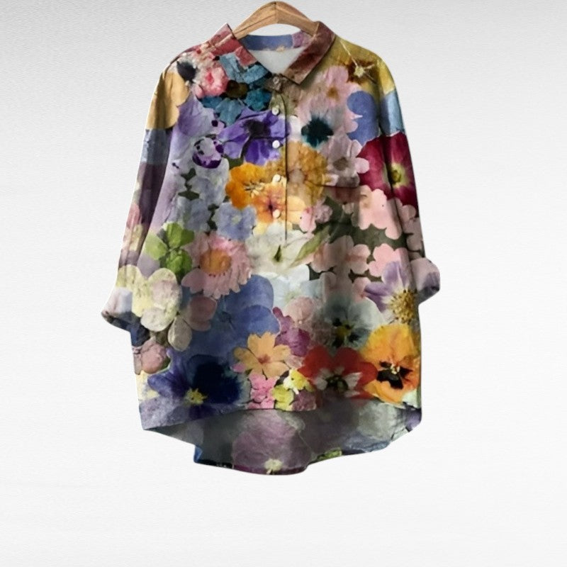 Blouse en lin multicolore à fleurs, manches longues, col chemise boutonné.